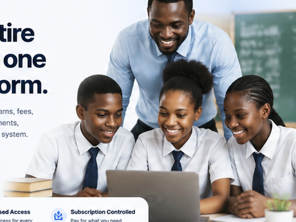 Teacher supporting students as they use a laptop for school work